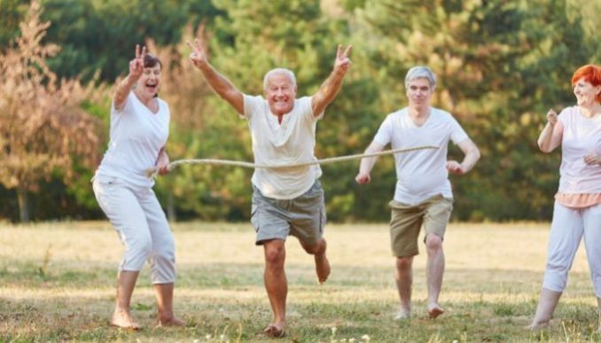 group of elderly people playing in the park