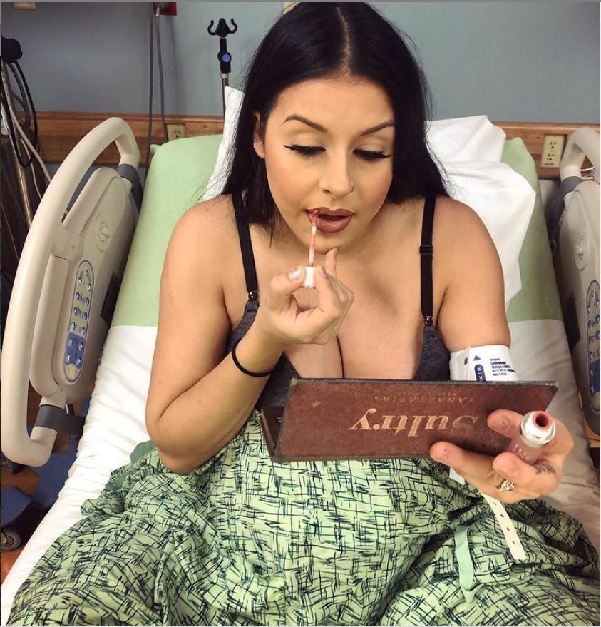 doing her lips and makeup before birth