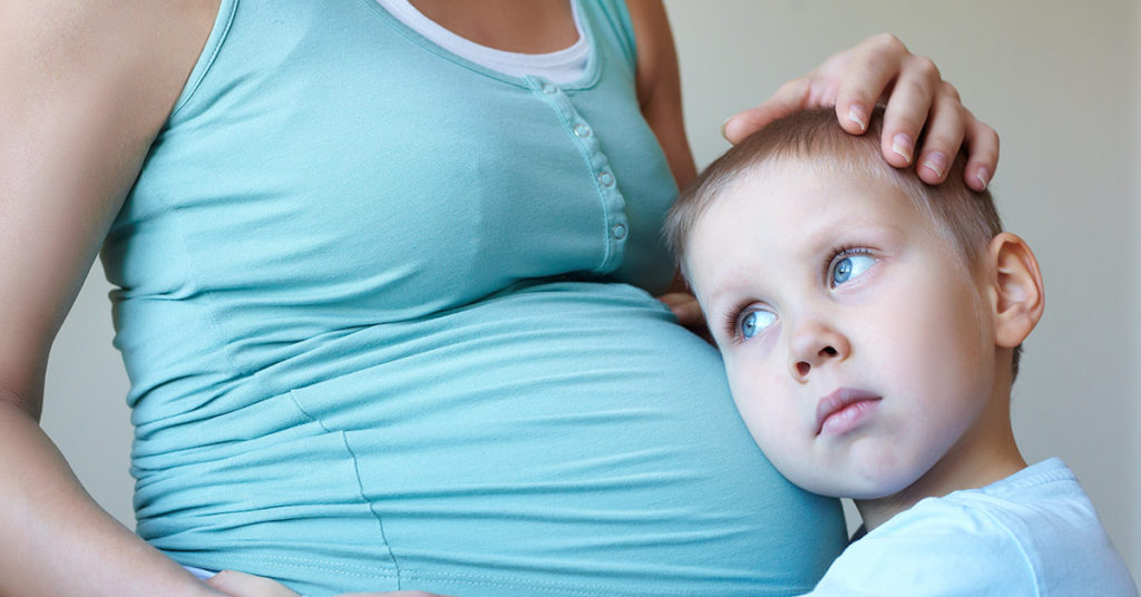 Heroic Pregnant Mother Throws Herself On Son To Shield Him From Gunfire - Featured image