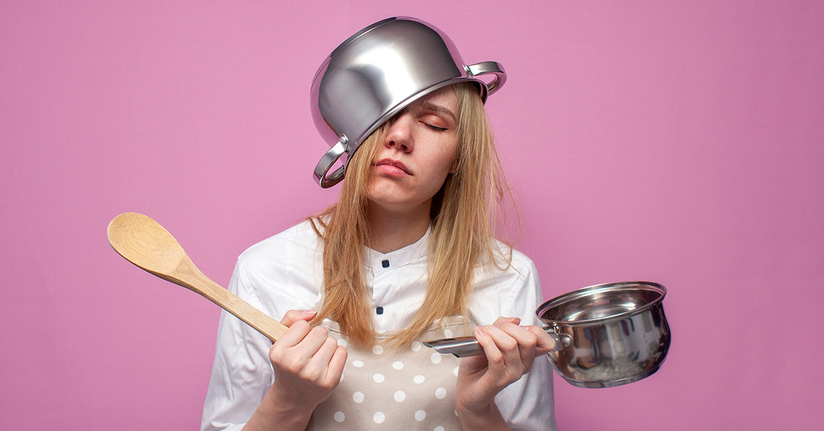 tired woman with utensils