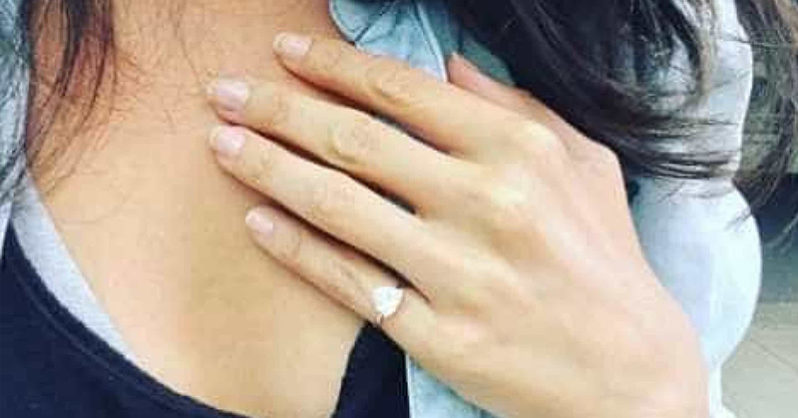 woman wearing wedding ring on pinky