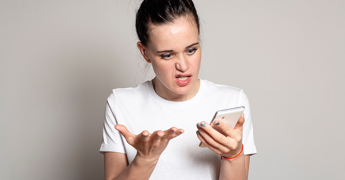 woman frustrated at phone