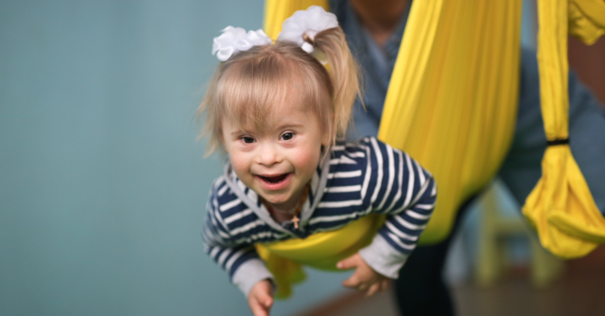 young blond girl with down syndrome