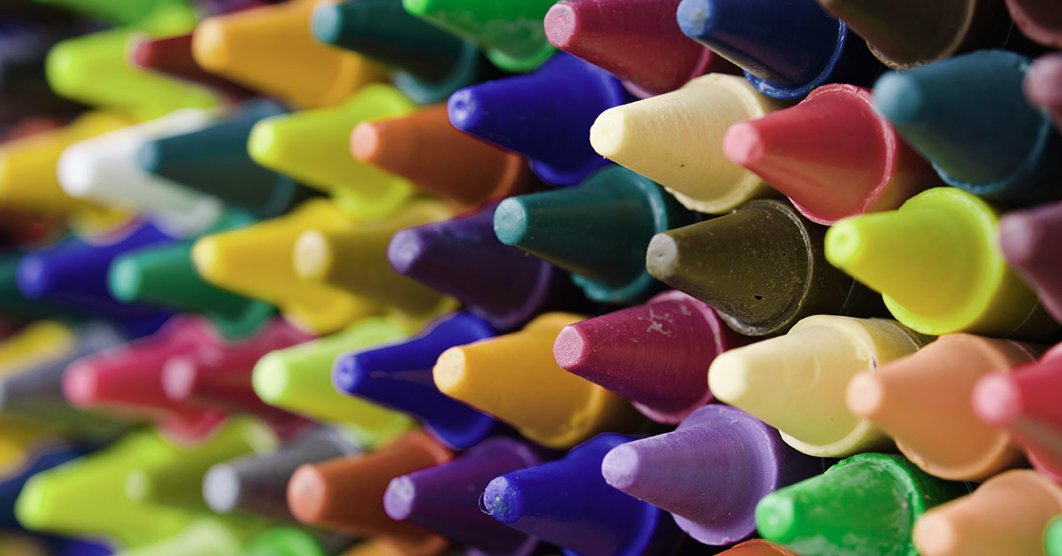 various colours of crayons stacked on one another