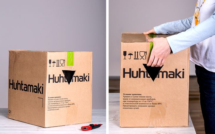 triangular holes cut in the side of cardboard boxes to carry them more easily