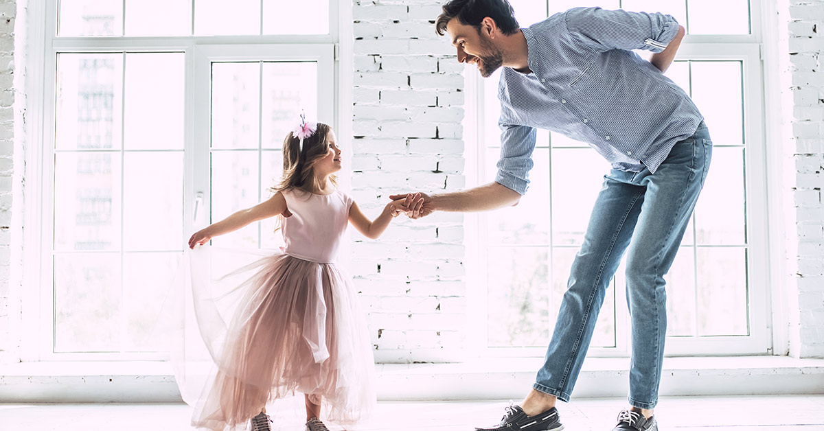 father with daughter in pink tutu