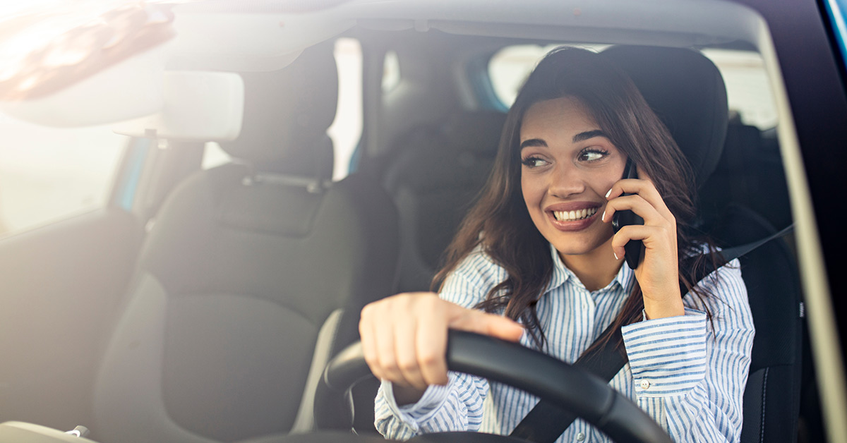 girl driving while on phone