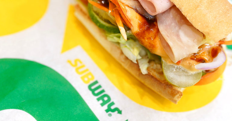 ‘If I saw this at a local Subway, I would not be bothered’: Subway worker makes sandwiches with baby strapped to chest in viral TikTok - Featured image
