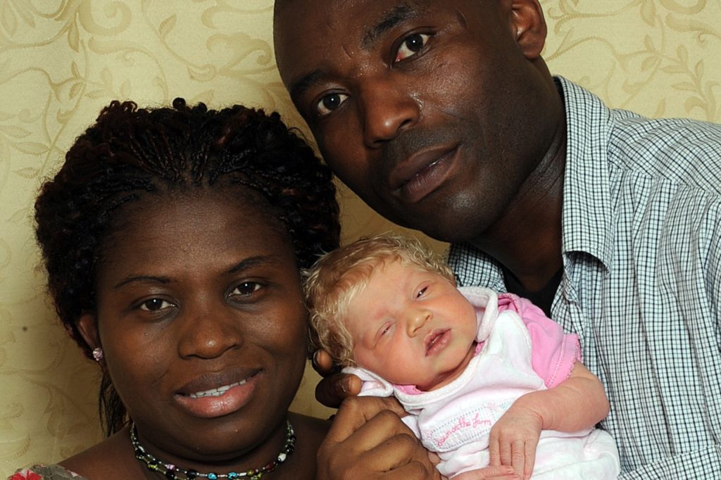 Ben Ihegboro and Angela Ihegboro with their daughter, 2010