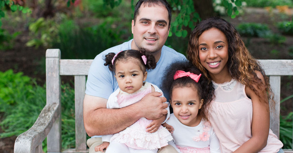 Can You Spot Why This Creepy Photo Of A Family Sitting On Bench Is Going Viral? - Featured image