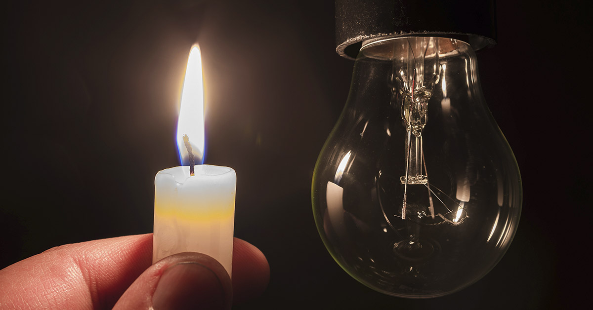 candle light and a light bulb that is not illuminated