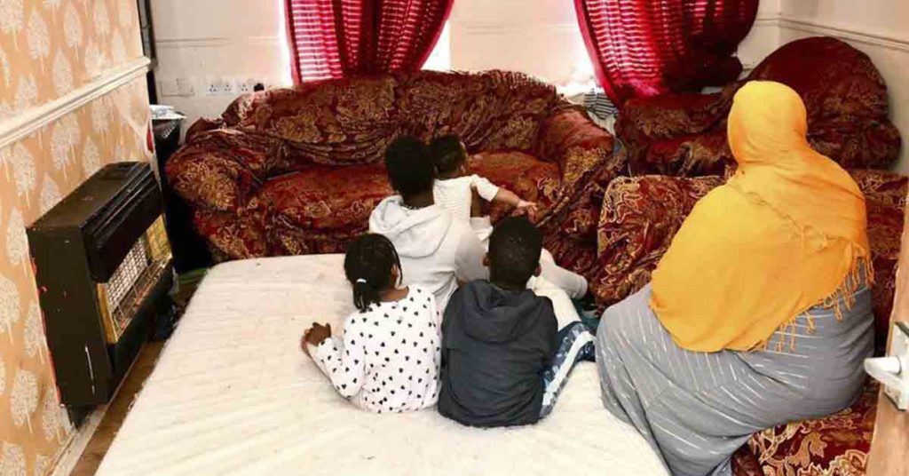 Family sleeping in one room in apartment where children believe mice a...
