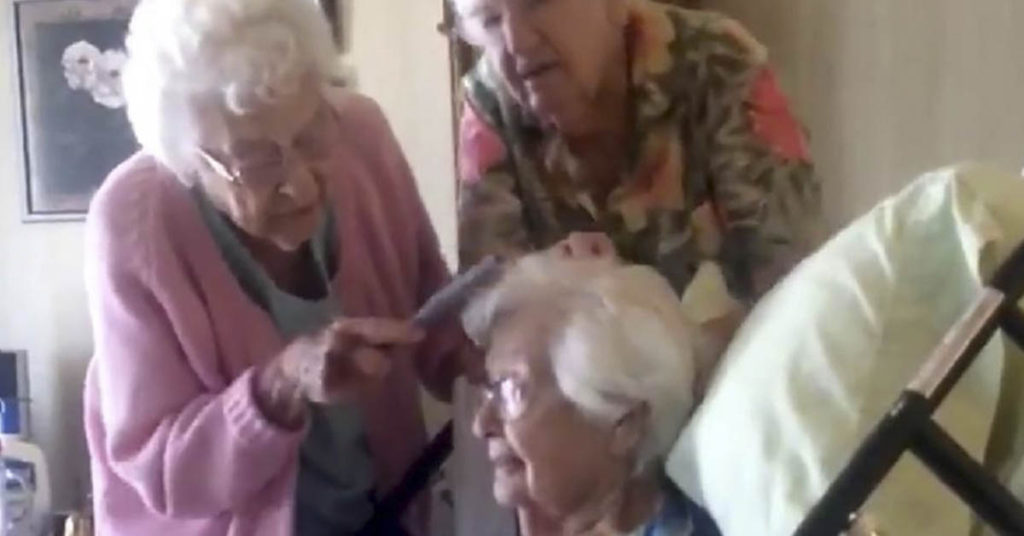 Four sisters in their 90s care for their elderly sister giving her a '...