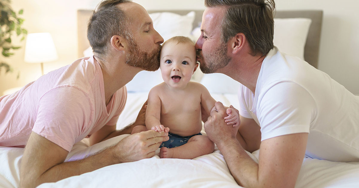 gay couple and their adopted baby