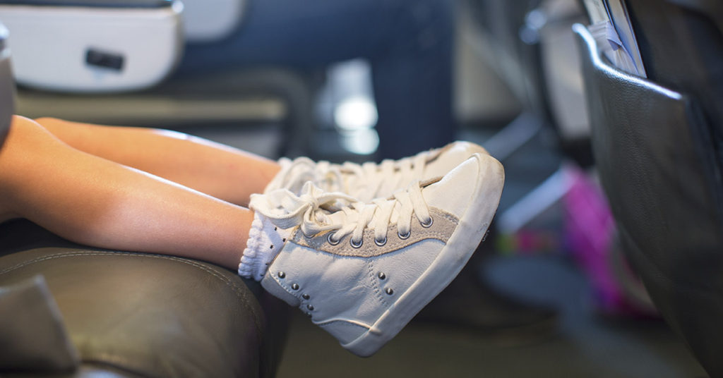 Airlines can no longer charge parents extra money for sitting next to their kids on airplanes - Featured image