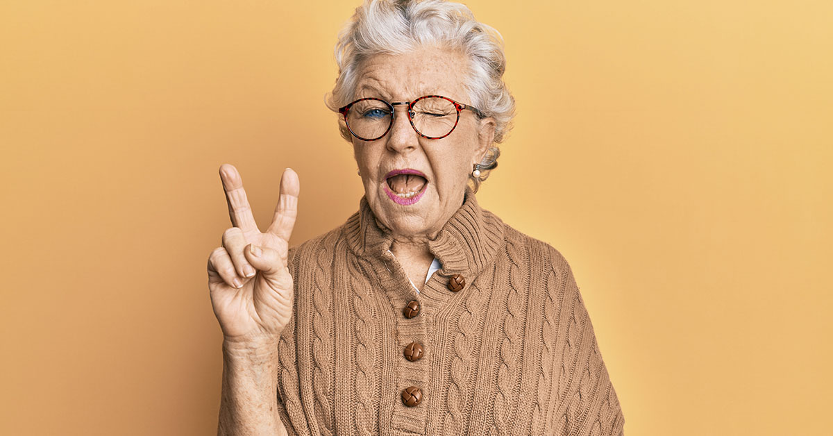 Grandmother doing a peace sign with her hand
