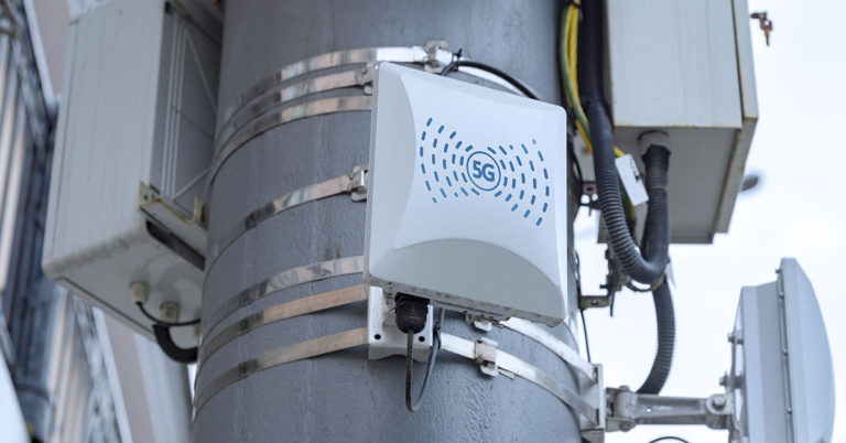 Angry mom parks her car on pavement to stop 5G masts being built - Featured image