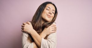 woman embracing herself