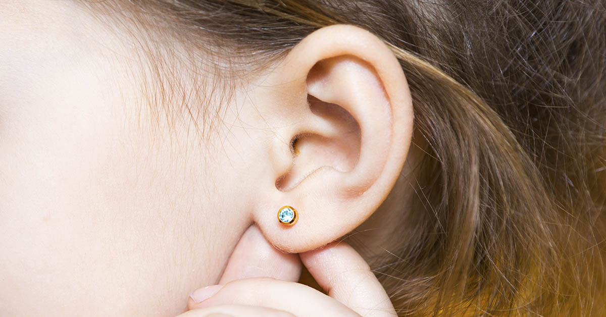 young girl pierced ear