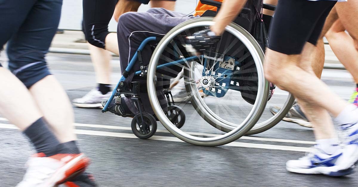 person in wheelchair in marathon