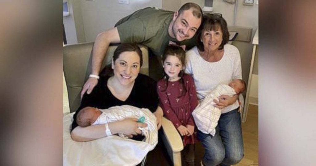 Tyler Sutton with his wife and children