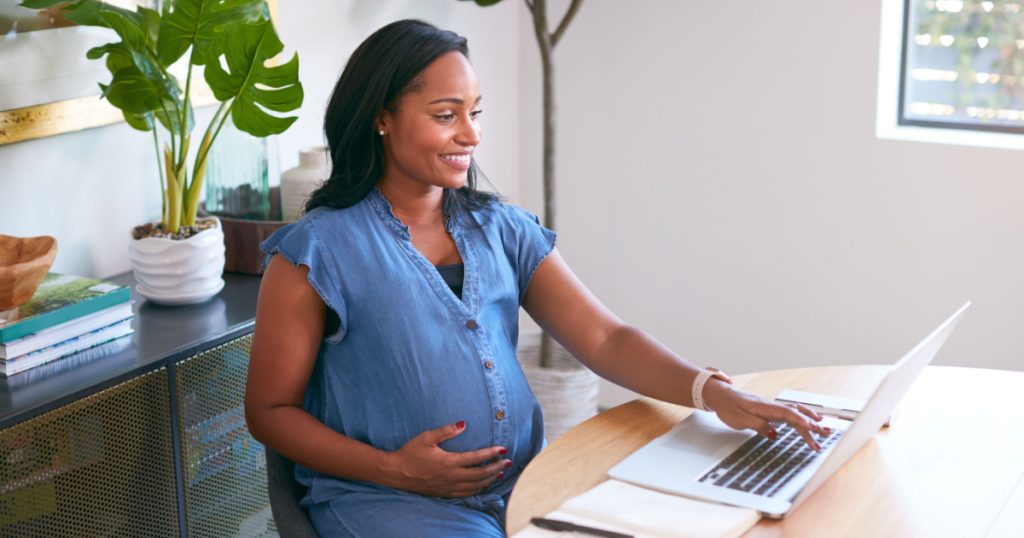 Pregnant African American Woman Using Laptop