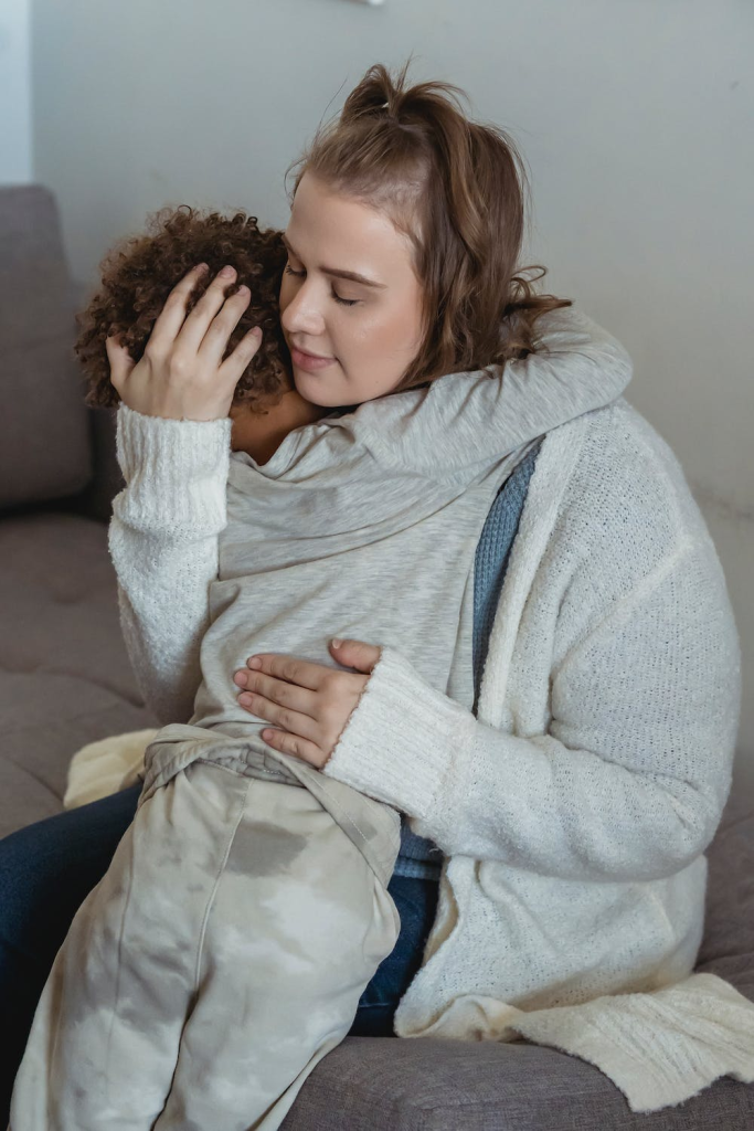 woman comforting child