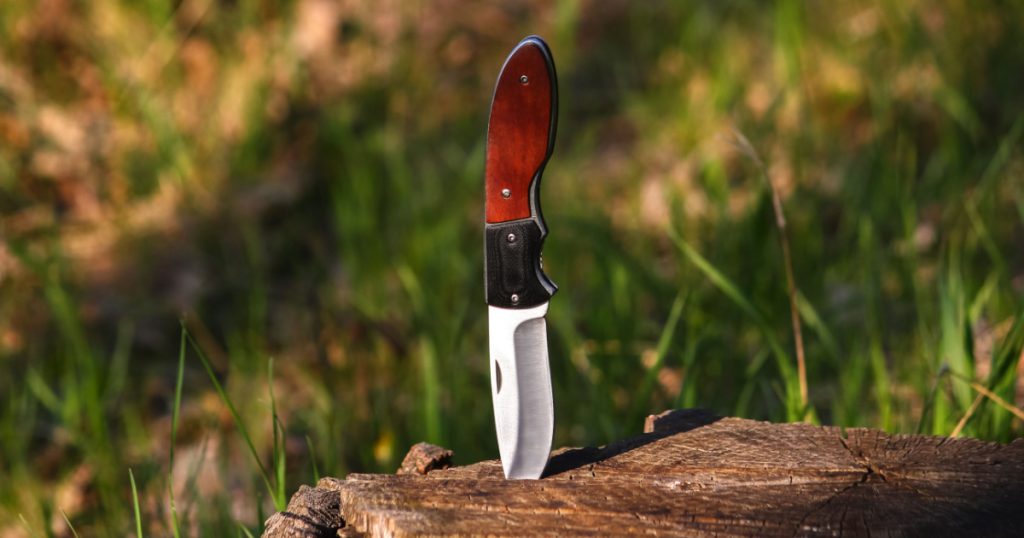 pocket knife in a stump 