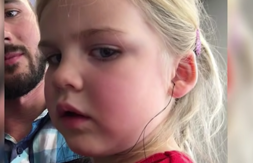 Little girl with hearing aid