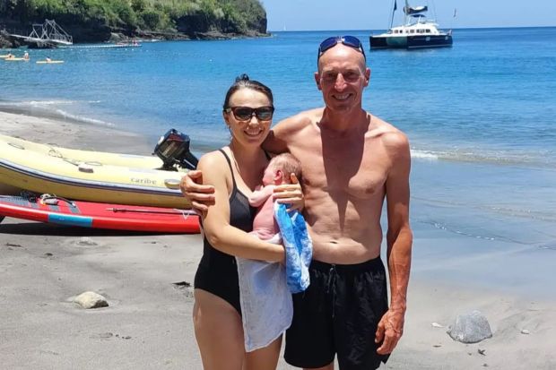 Parents and baby on a beach