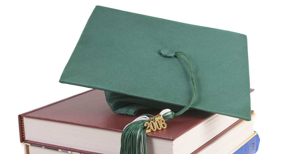 graduation hat set on top of books