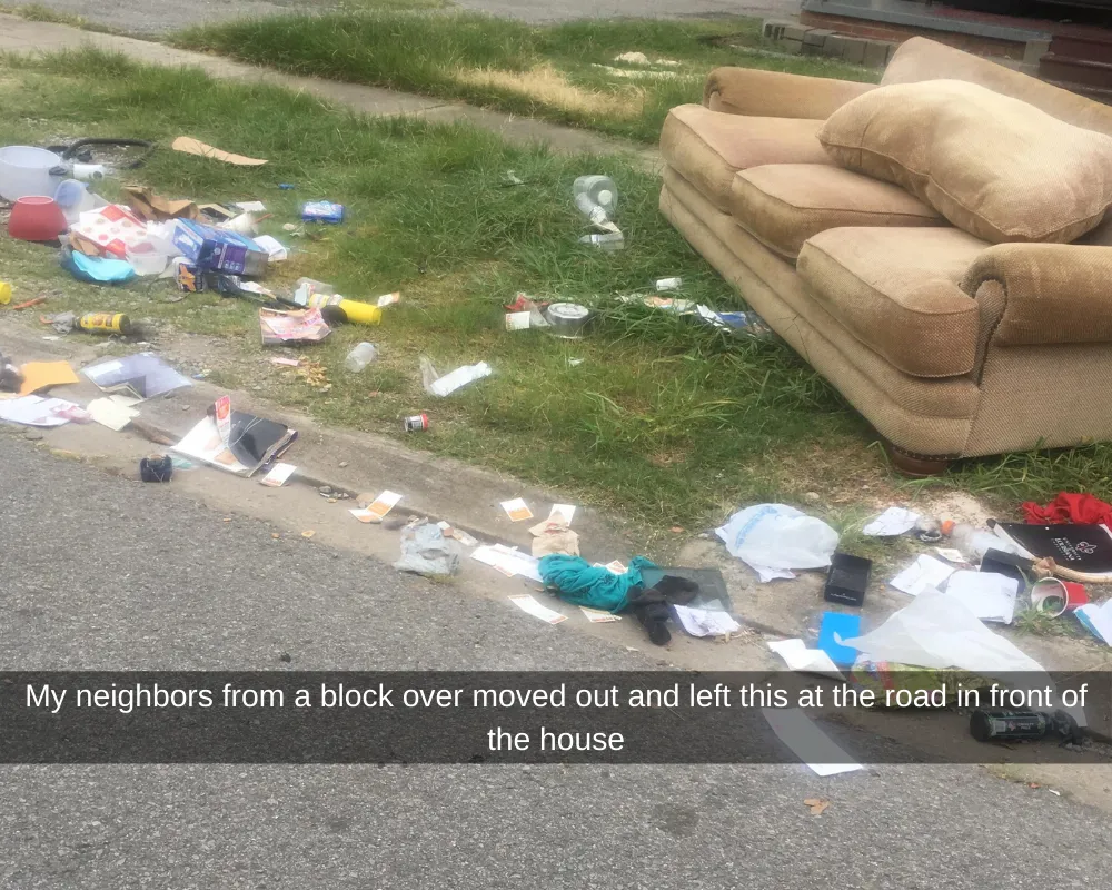 Litter covered street with couch