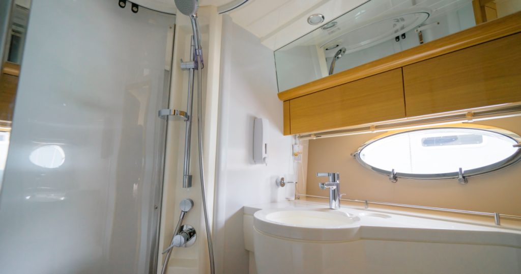 Luxury traveling. Bathroom interior of modern motor yacht.
