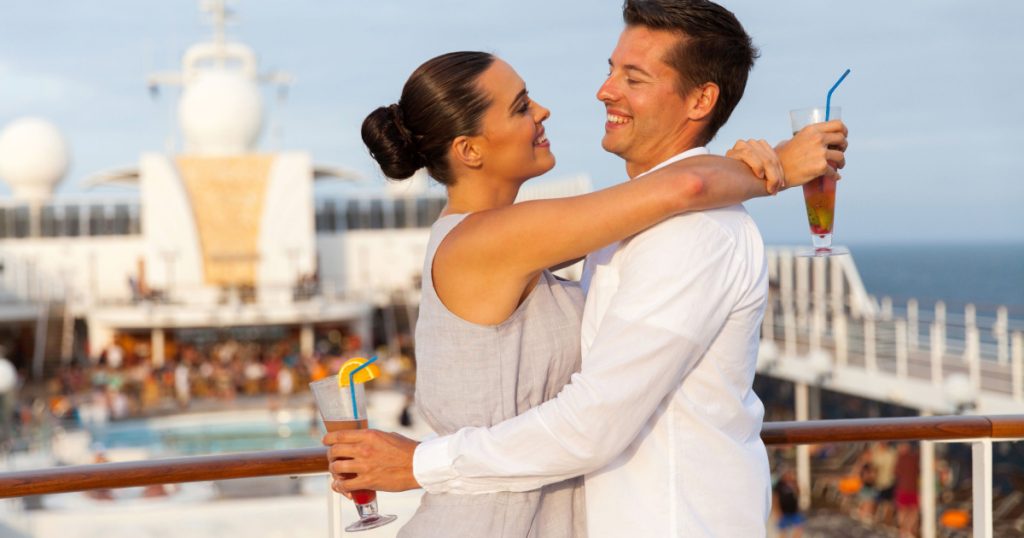 portrait of lovely couple embracing on cruise ship
