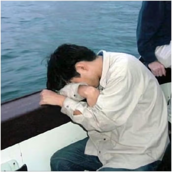 man suffers from motion sickness while on a boat trip. Fear of traveling or illness of the virus during a cruise holiday. 