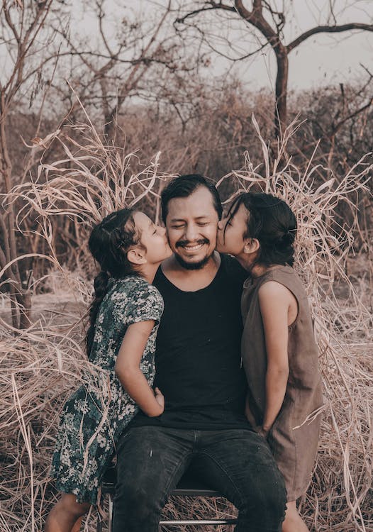 Man with two daughters