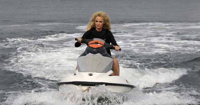 Pamela Anderson wears no makeup at Paris Fashion Week after sharing tragic reason for ditching glam - Featured image