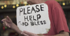 panhandler holding sign