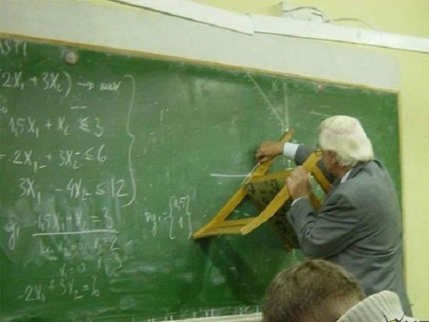 Teacher using chair to draw