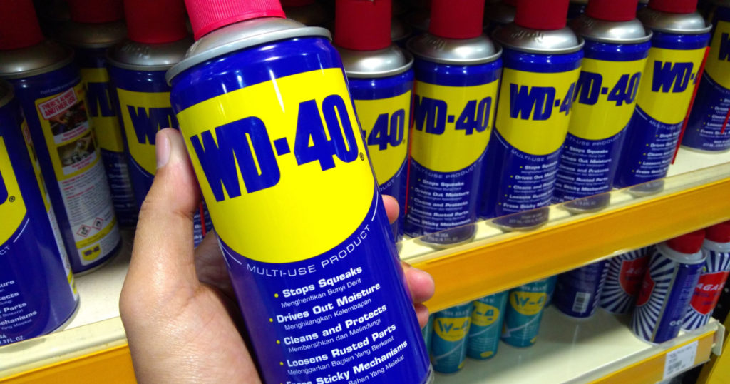 Klang, Malaysia - October 8, 2018 : Hand hold WD-40 is the trademark name of the penetrating oil and water-displacing spray is now available in Malaysia hardware stores
