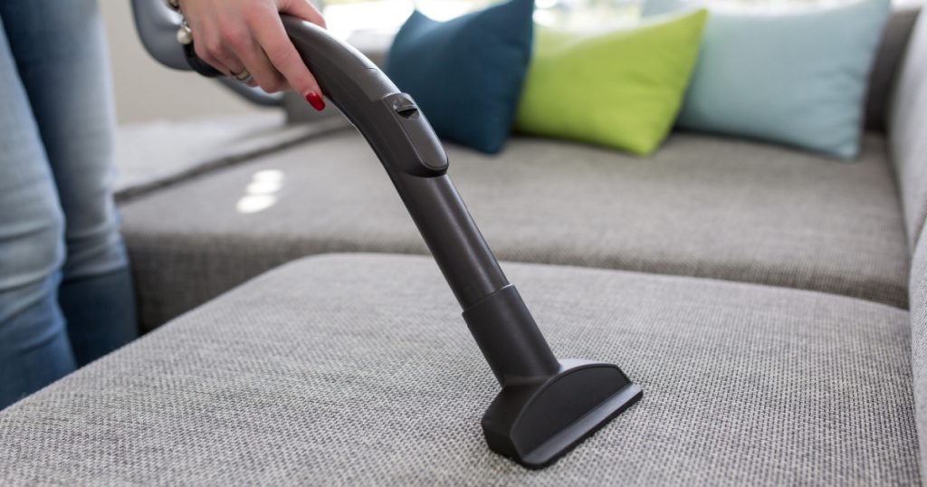Cleaning the Sofa with Vacuum Cleaner
