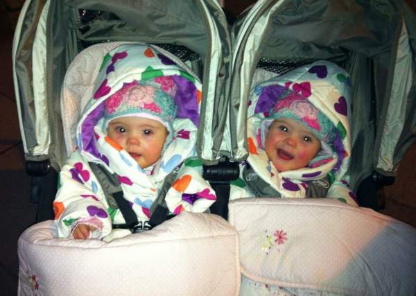 Sweet babies, cozy in their stroller