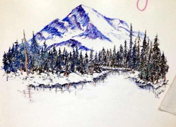 Drawing of mountains on whiteboard