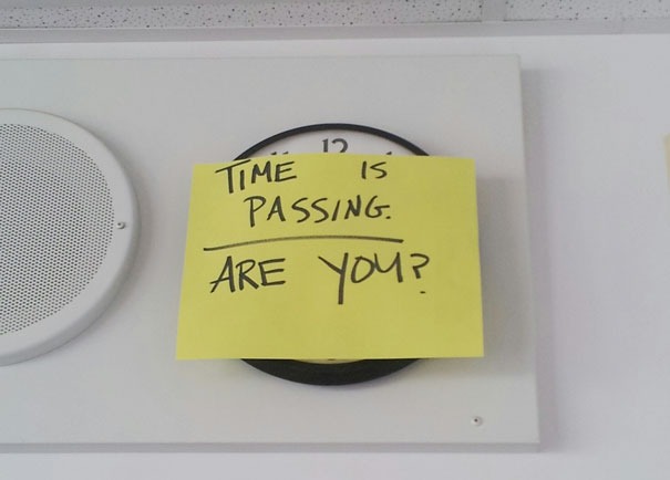 Witty exam message on top of wall clock.