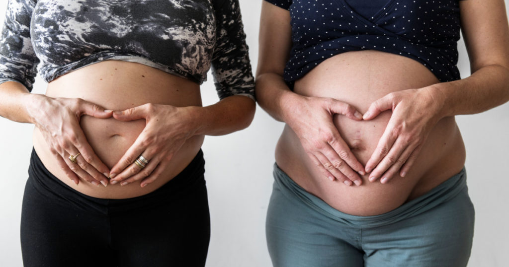 Pregnant women showing their bumps
