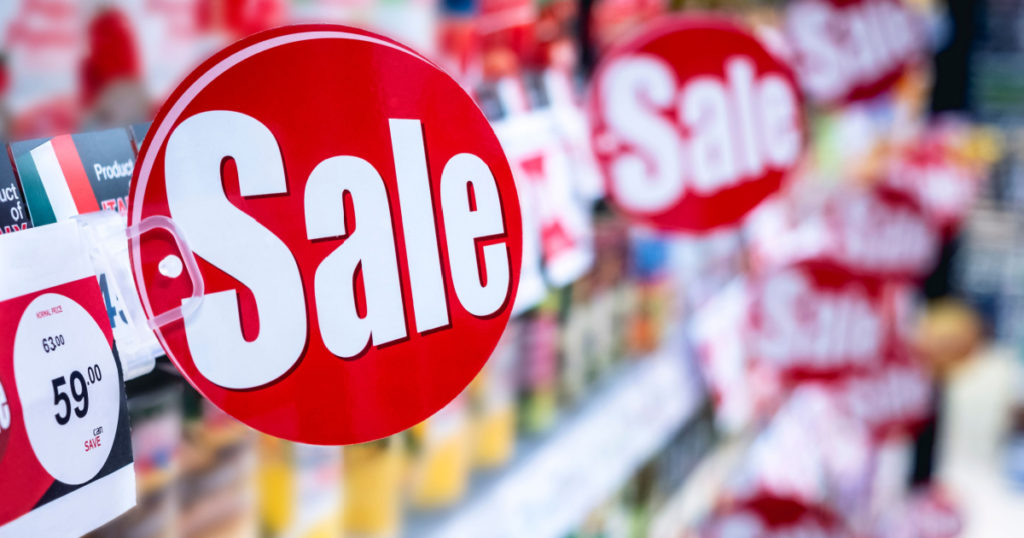 Sale Promotion Discount sign on Supermarket shelf Marketing Retail Business
