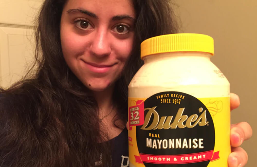 Apply the mayonnaise generously over your hair, ensuring it's thoroughly distributed.