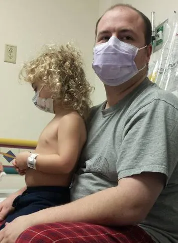 Kaizler and his dad while Kaizler is getting chemo