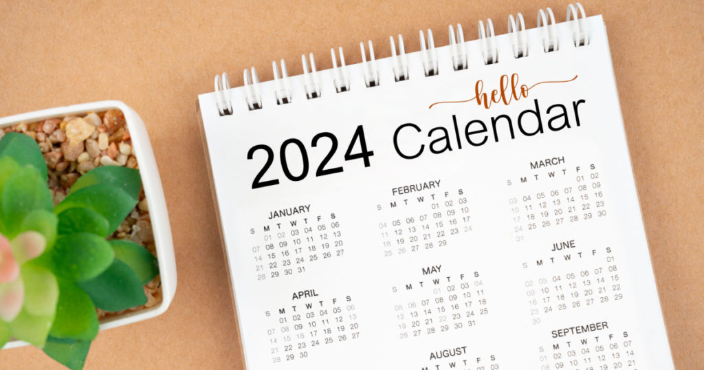 Hello 2024 calendar. 12 months desk calendar 2024 on brown background.