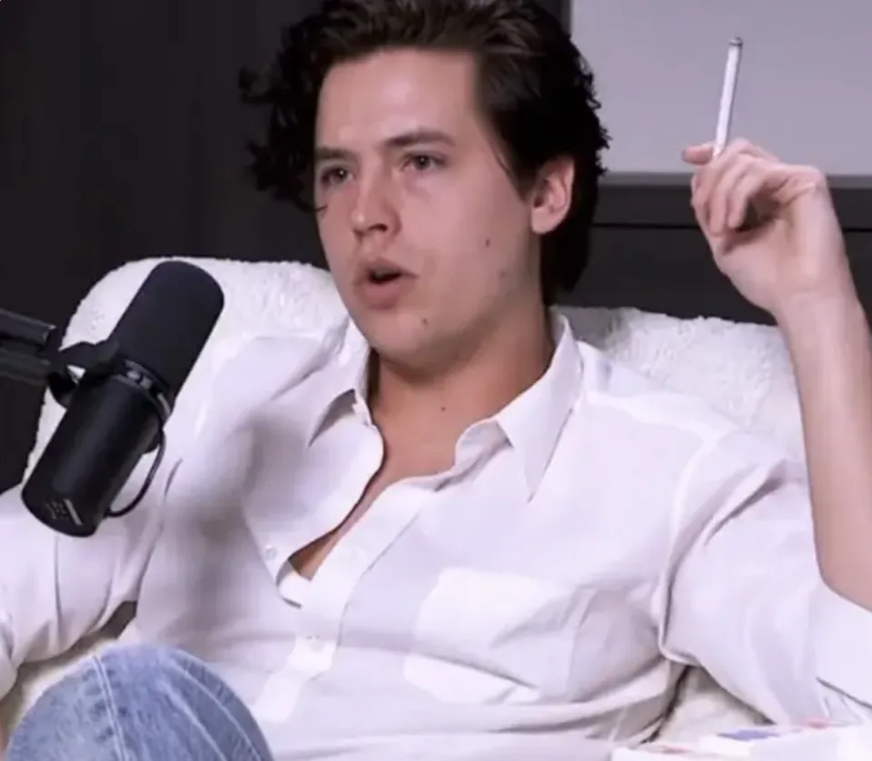 Cole Sprouse smoking a cigarette on a Podcast Interview